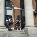 The 2 woman band named Detention perform on the front steps of the Library during Night Market