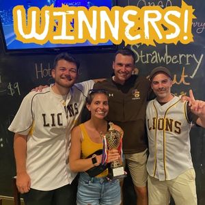 Winners of the guest bartending fundraiser hold their trophy