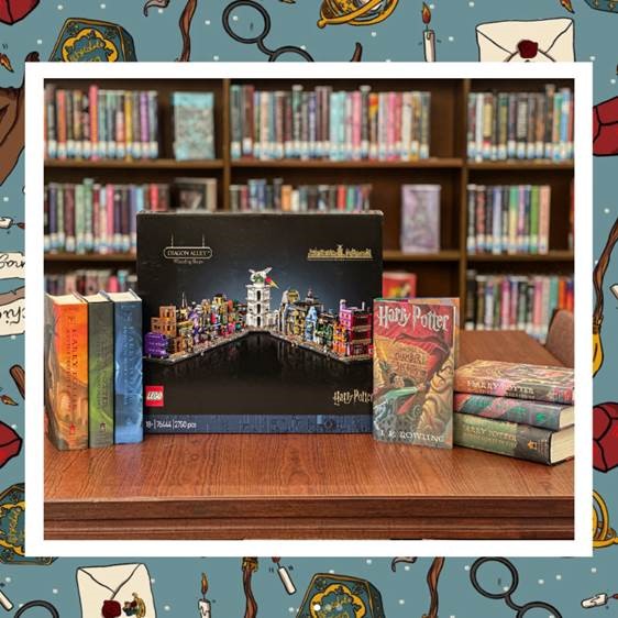 photo of all seven Harry Potter books and the Diagon Alley Lego set sitting on a table in front of a library's book shelf
